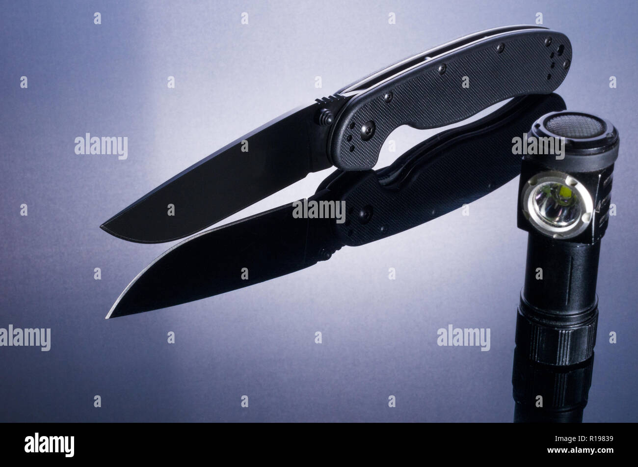 A set of military. Knife and flashlight Stock Photo Alamy