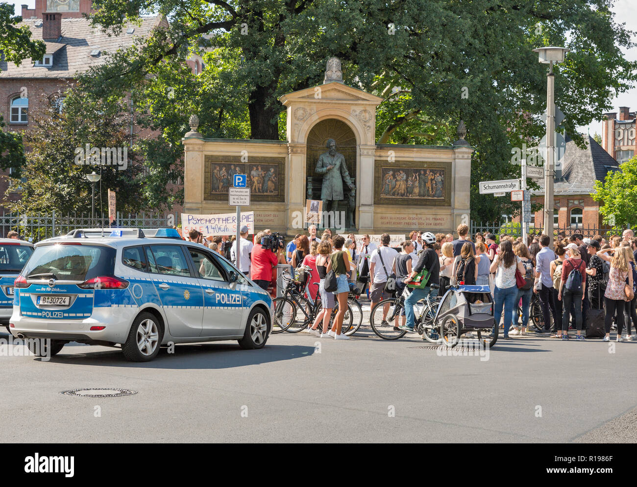 BERLIN, GERMANY - JULY 13, 2018: Strike of young doctors against payment reduction for psychotherapy in front of Albrecht von Graefe Memorial at the C Stock Photo