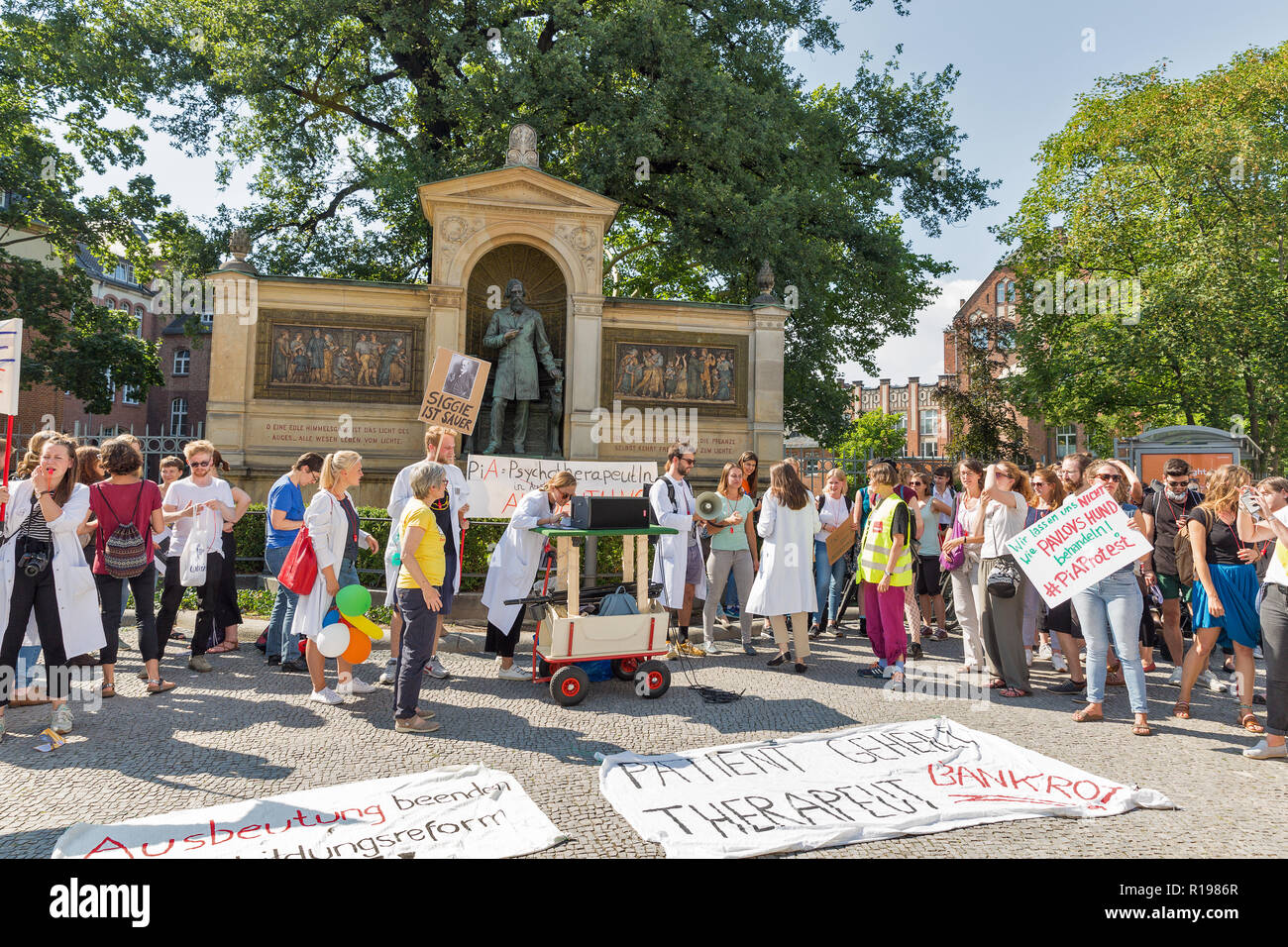 BERLIN, GERMANY - JULY 13, 2018: Strike of young doctors against payment reduction for psychotherapy in front of Albrecht von Graefe Memorial at the C Stock Photo
