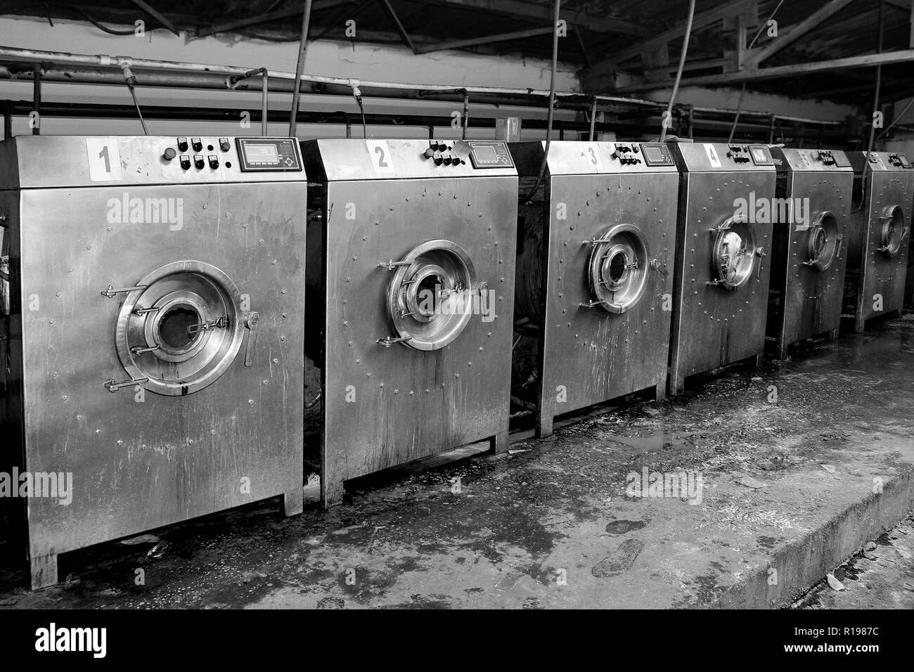 Black and white workshop of old washing machines with old washing machines Stock Photo
