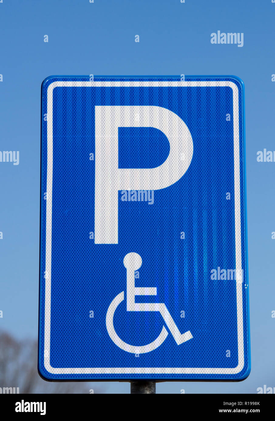 Sign in a car park indicating a parking space for disable drivers Stock