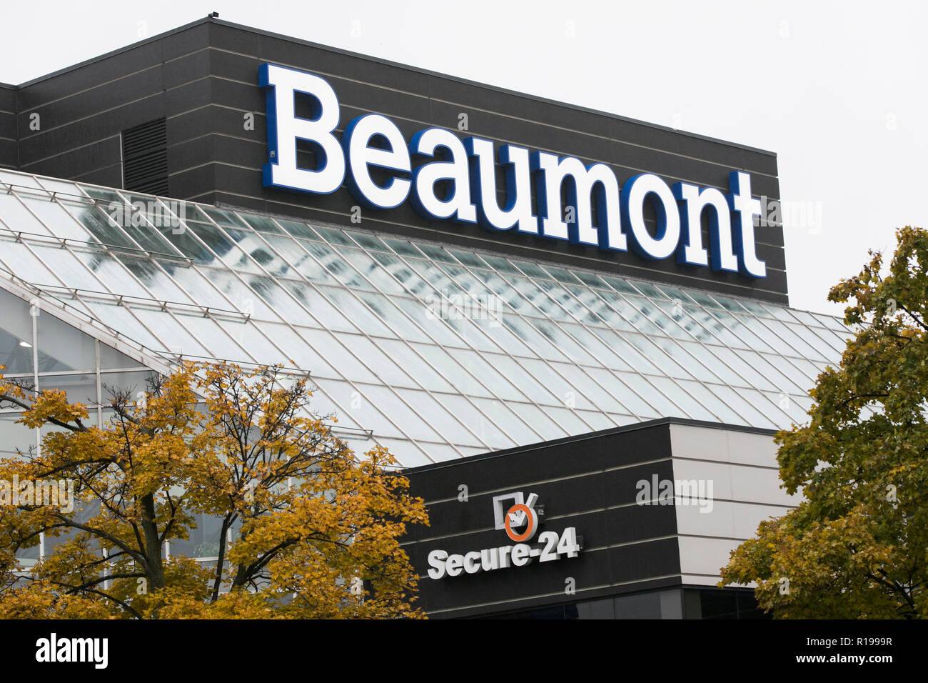 A logo sign outside of a facility occupied by Beaumont Health in