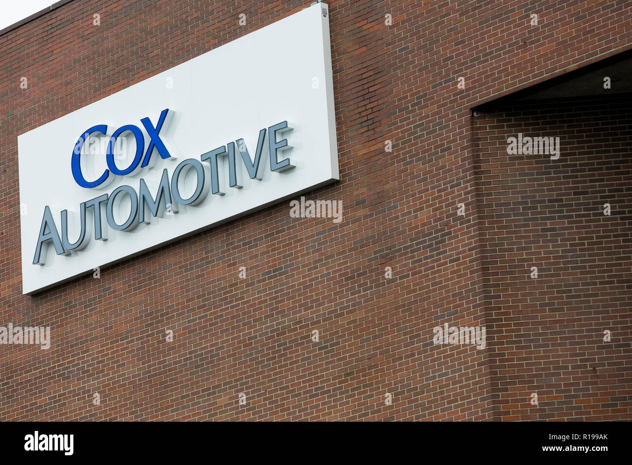 A Logo Sign Outside Of A Facility Occupied By Cox Automotive In
