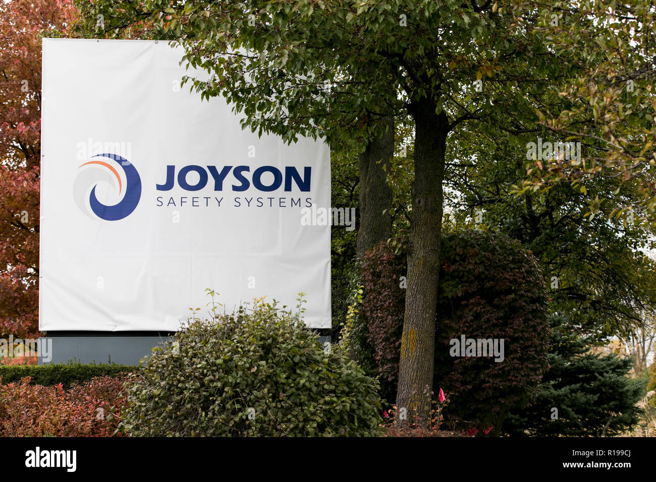 A logo sign outside of a facility occupied by Joyson Safety Systems in