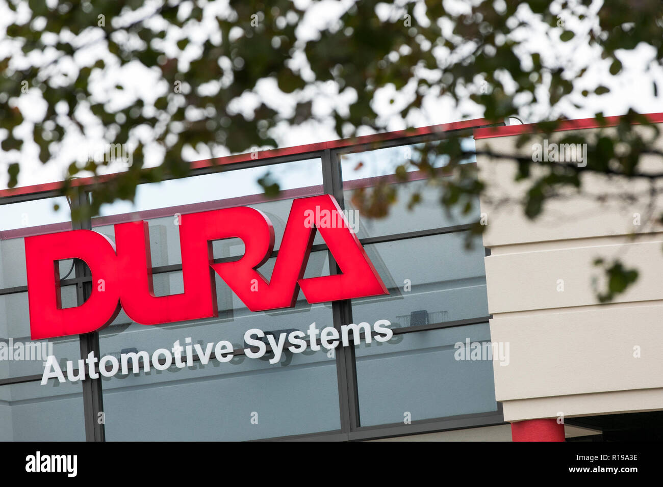 A logo sign outside of the headquarters of Dura Automotive Systems in
