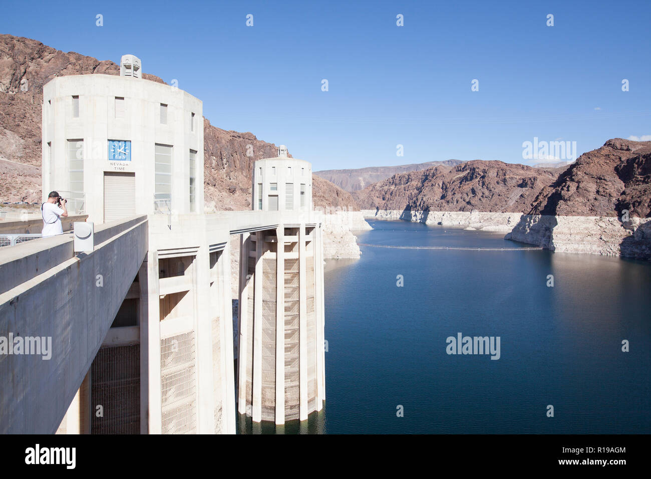 the reservoir behind Hoover Dam and the water towers. The cliffs discoloration shows how much Lake Mead has receded in level Stock Photo