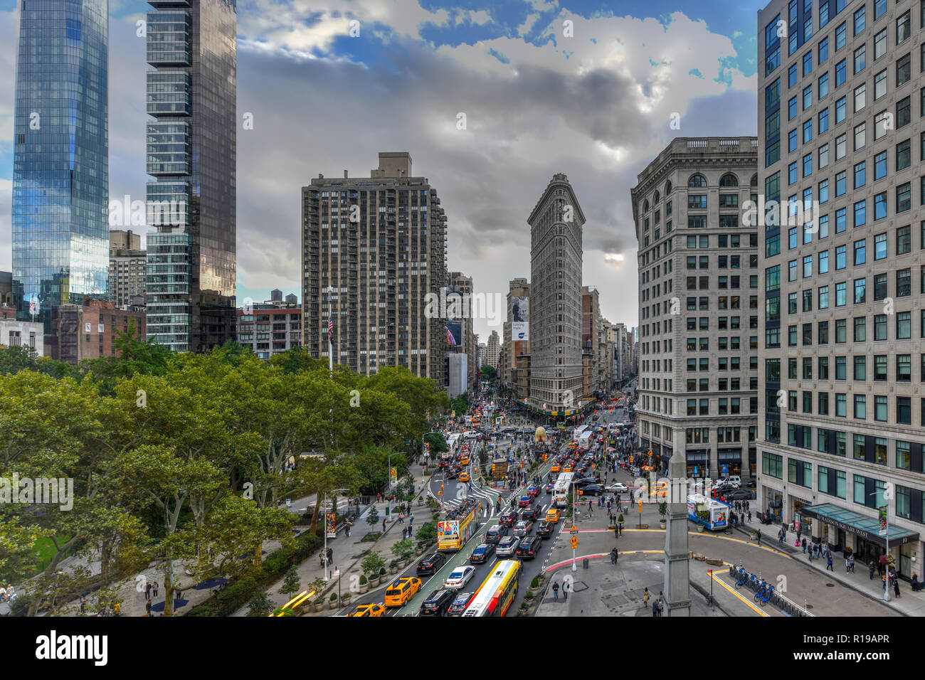 New York City - October 10, 2018: Aerial view of the Flat Iron building, one of the first skyscrapers ever built, with NYC Fifth Avenue and taxi cabs. Stock Photo