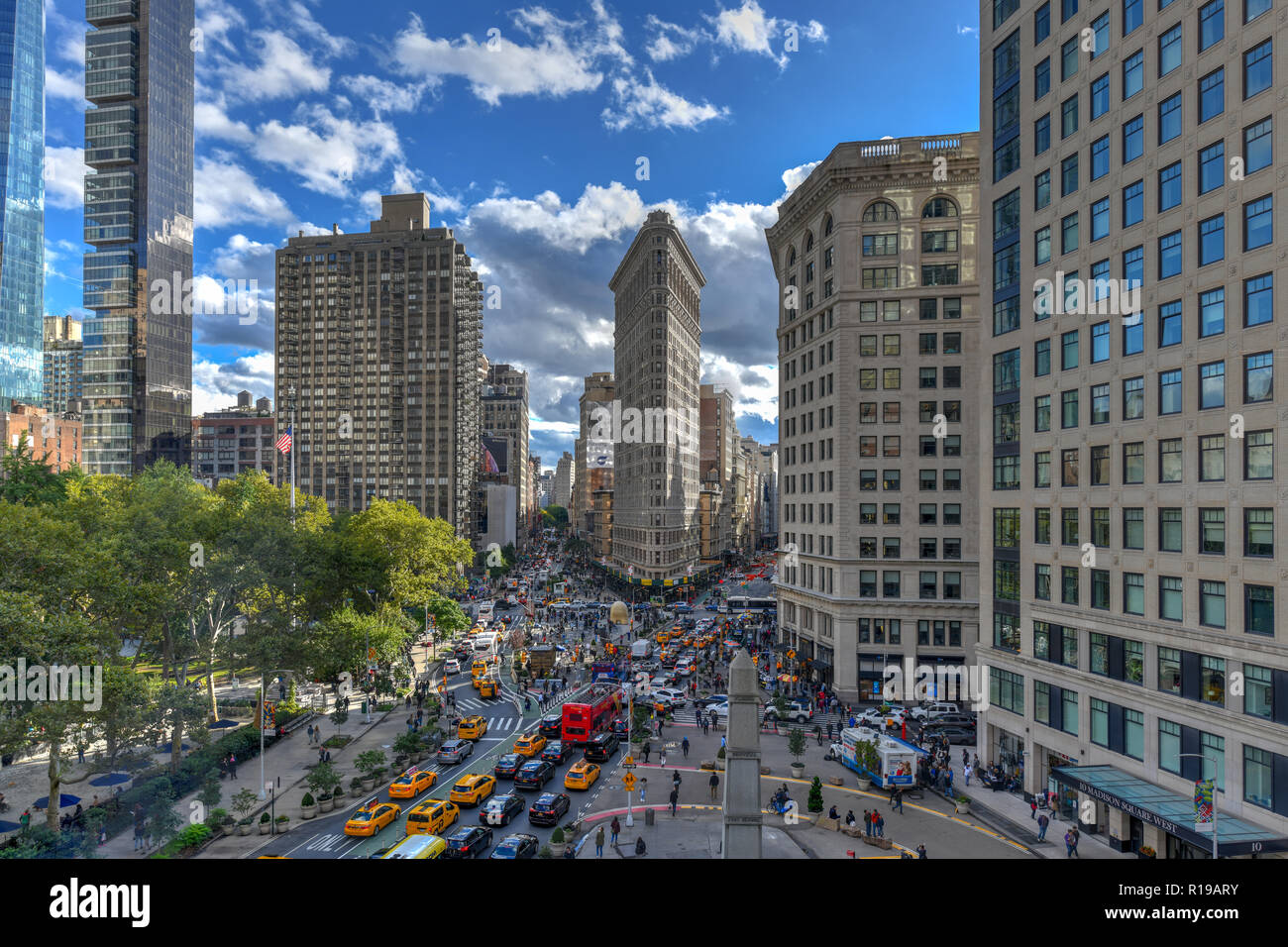 New York City - October 10, 2018: Aerial view of the Flat Iron building, one of the first skyscrapers ever built, with NYC Fifth Avenue and taxi cabs. Stock Photo