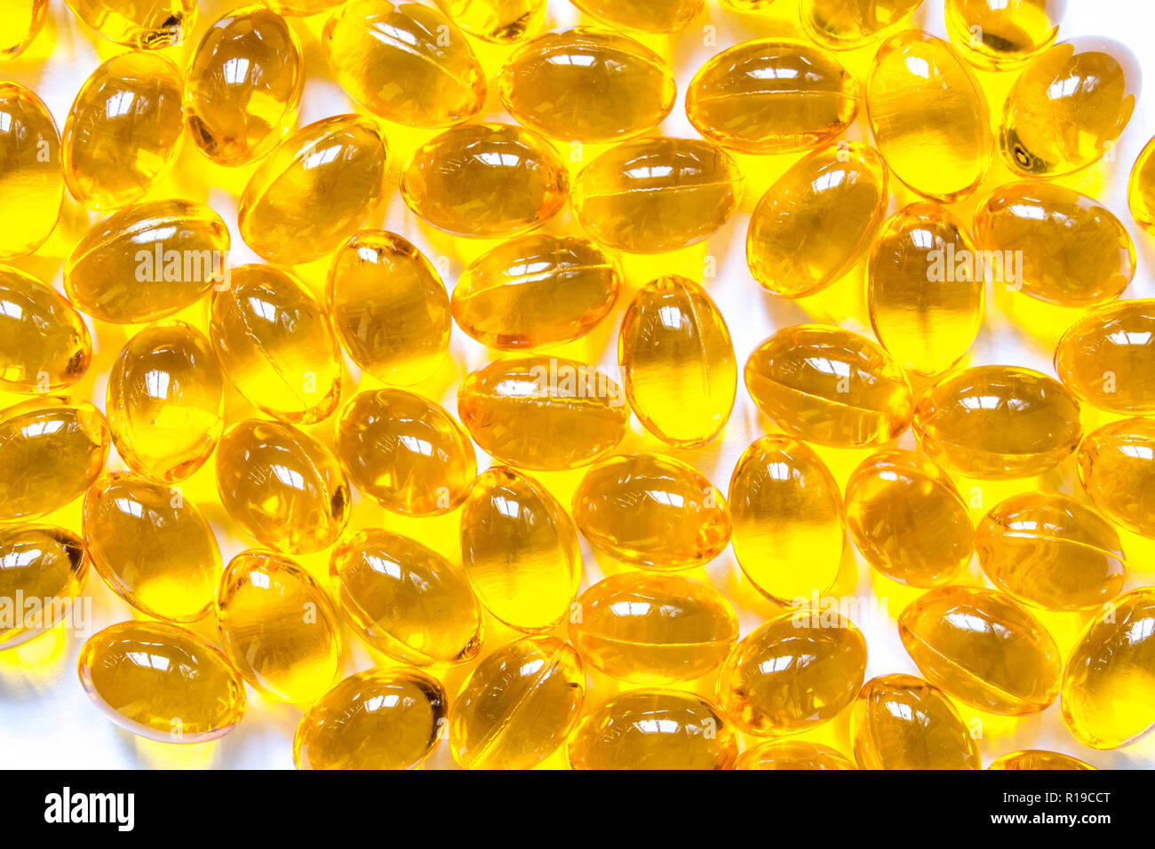 Fish oil capsule pills closeup background Stock Photo Alamy