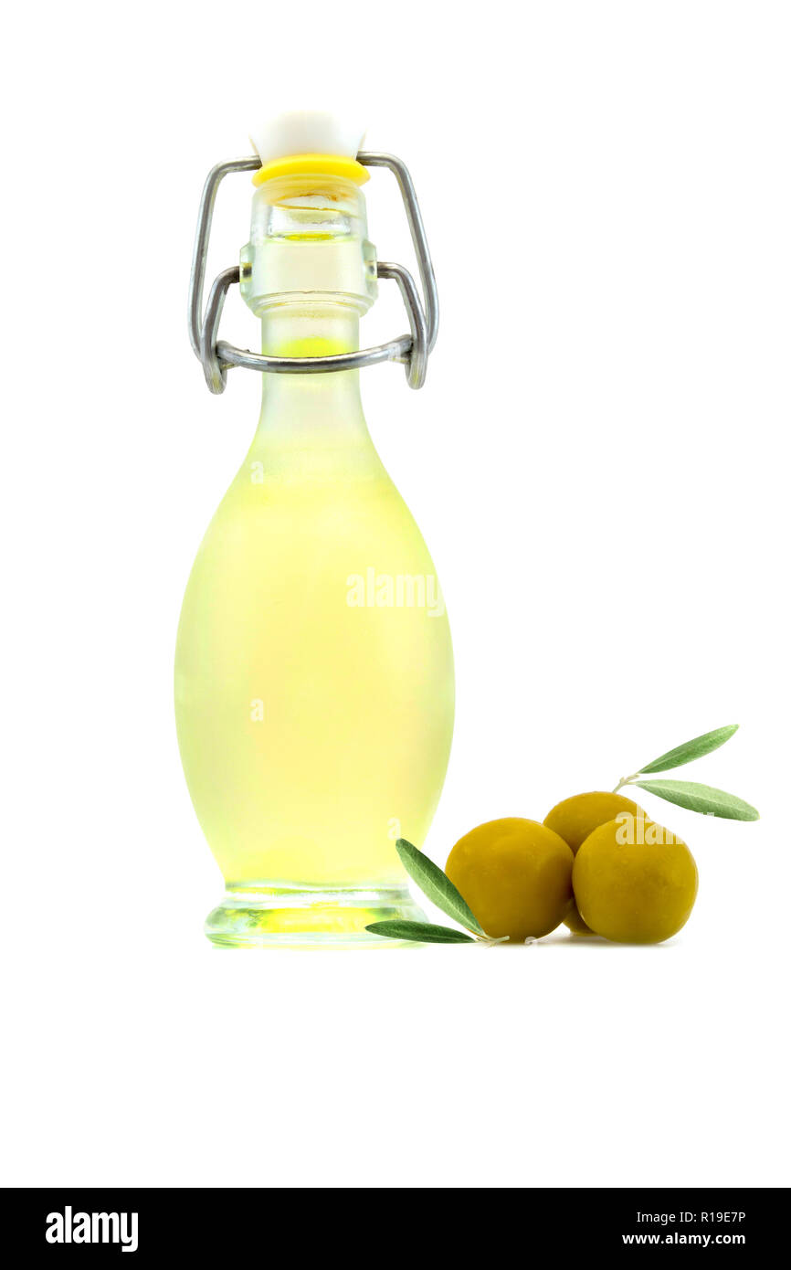 Bottle of olive oil and olives with leaves isolated on a white ...