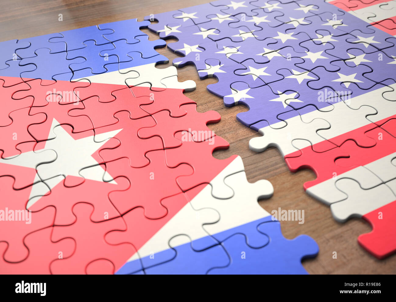 Two nations joining in a puzzle game that represents union, peace, commerce, social and human agreement. Stock Photo