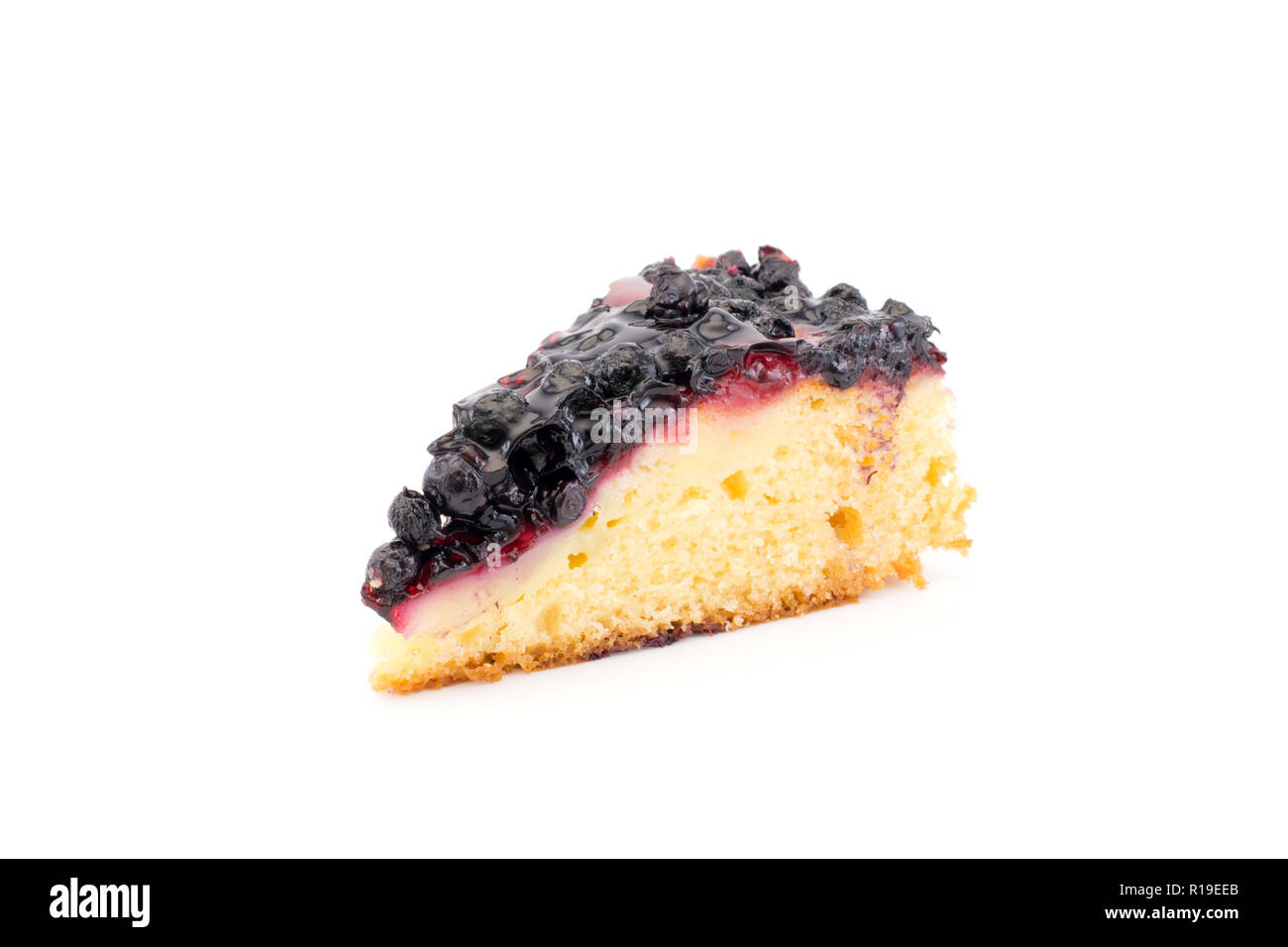 A piece of cake with fresh blueberries isolated on a white background Stock Photo