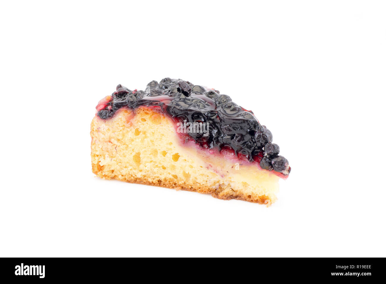 A piece of cake with fresh blueberries on a white background Stock Photo
