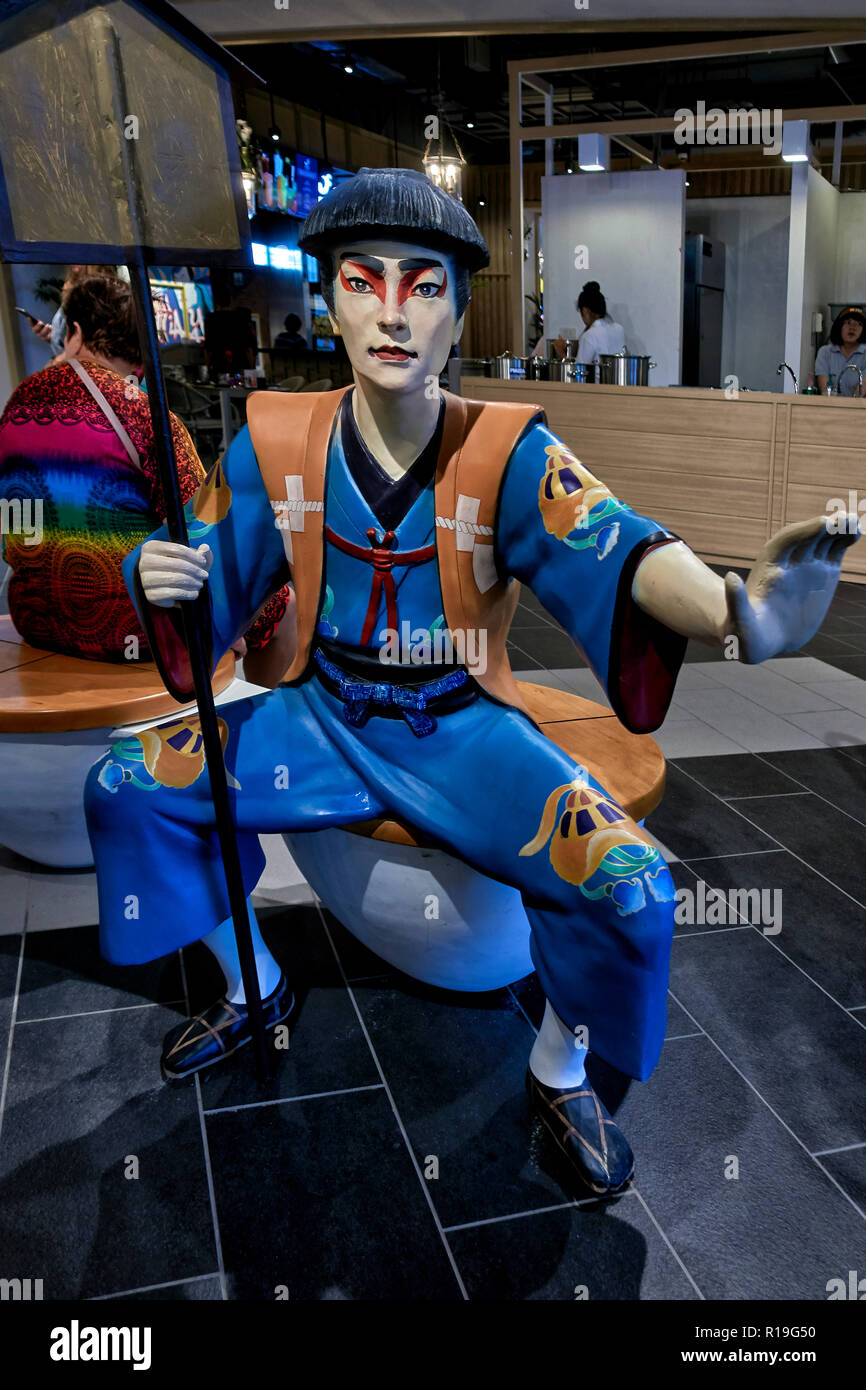 Japanese statue of people in traditional dress Stock Photo