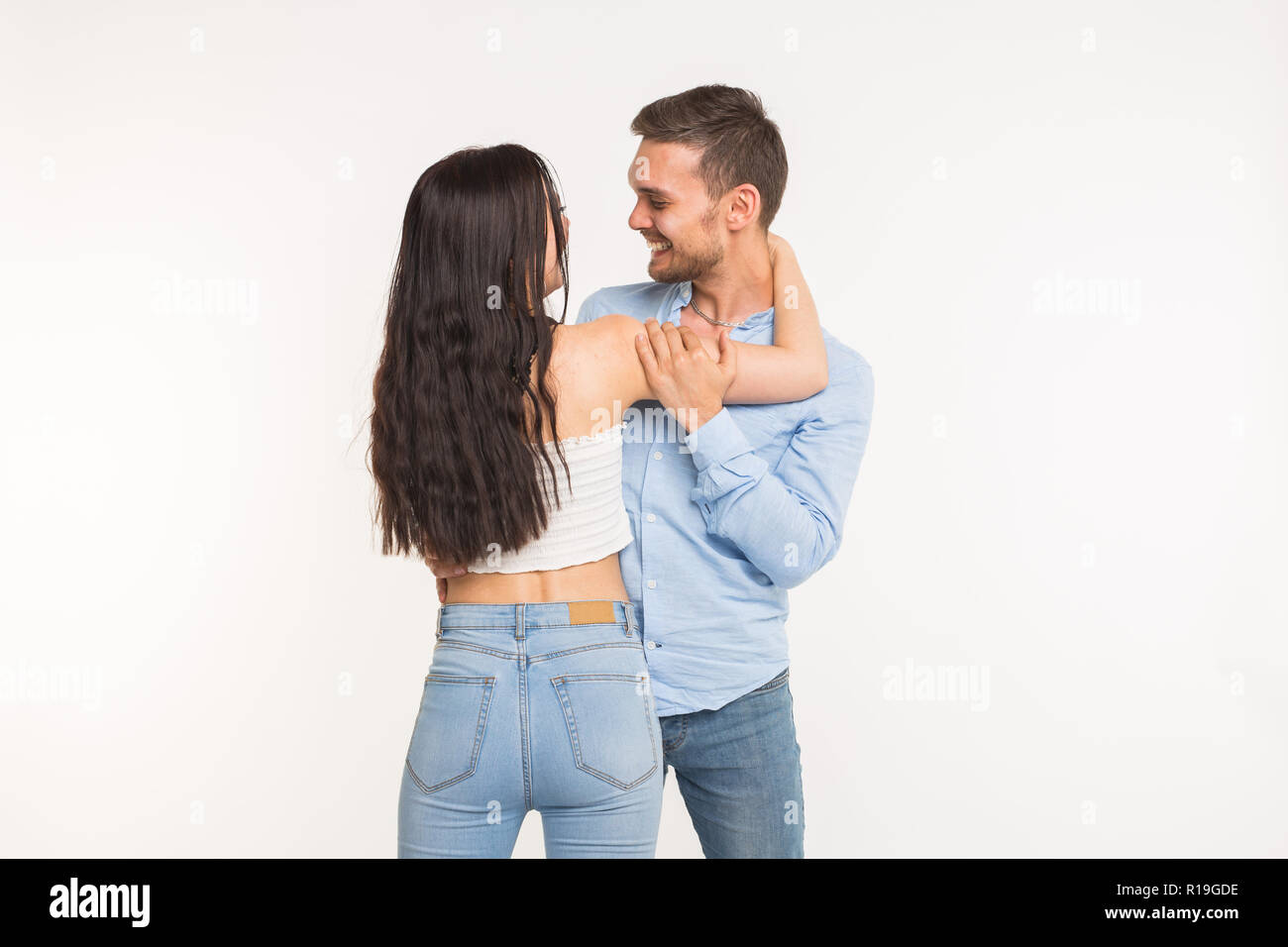 Relationship and family concept - Portrait of hugging couple on white ...
