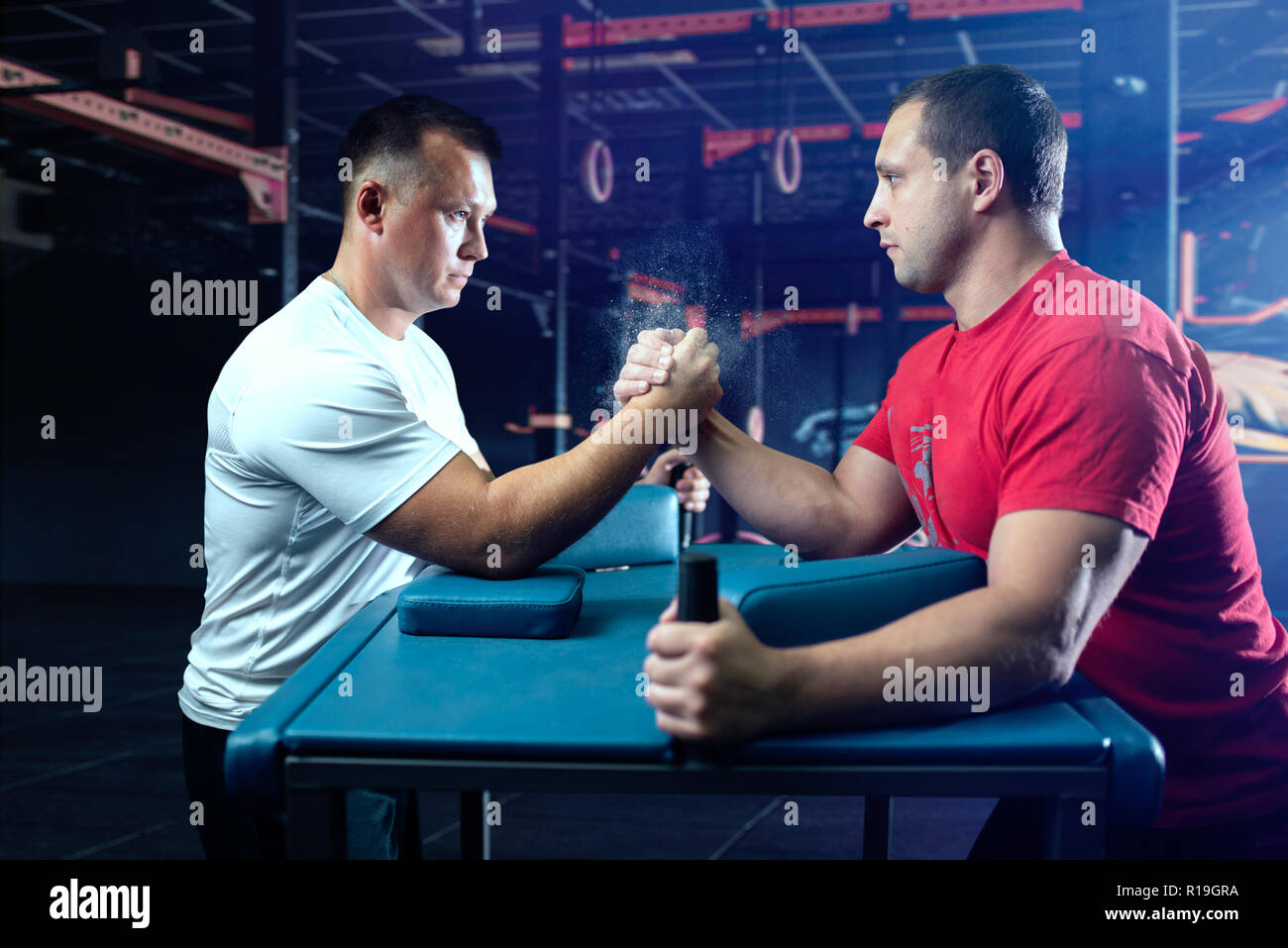 Two arm wrestlers on starting position, wrestling competition. Wrestle  challenge, power sport Stock Photo - Alamy