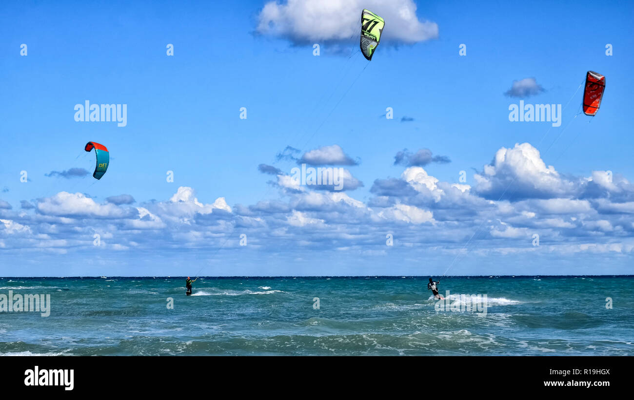 Cesine, Italy - September 21, 2017: Athletes practicing kitesurf in the Adriatic sea Stock Photo