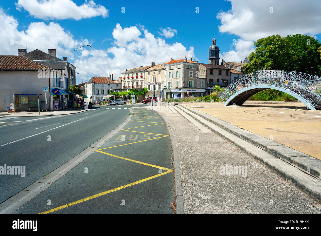 Melle, Deux-Sevres, France - July 6, 2011: Road through Melle in France with decorative bridge on a warm summer day Stock Photo