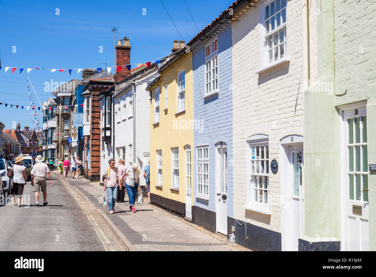 Southwold Suffolk People walking past the traditional architecture of Suffolk Houses on the High street Southwold Suffolk England UK GB Europe Stock Photo