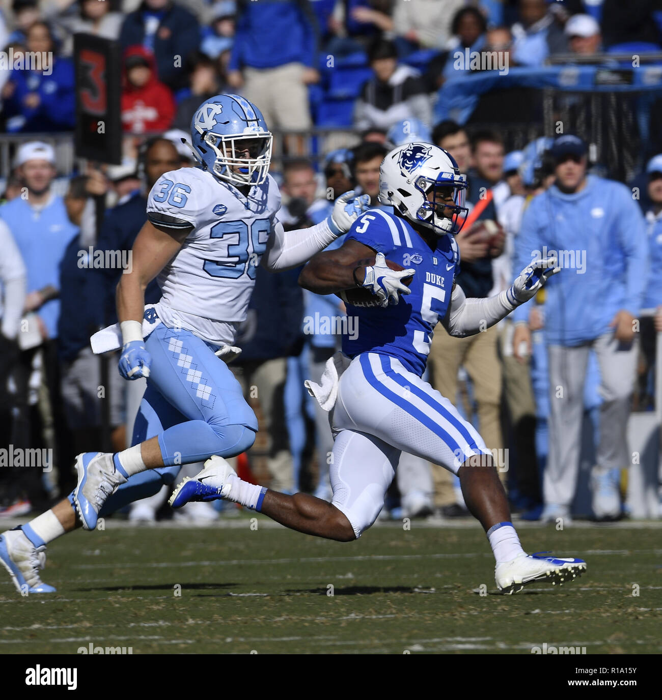 Durham, North Carolina, USA. 10th Nov, 2018. JOHNATHAN LLOYD (5) of Duke carries the ball against COLE HOLCOMB (36) of UNC. The Duke Blue Devils played the North Carolina Tar Heels in a football game that took place on the Brooks Field at Wallace Wade Stadium in Durham, N.C. on Saturday, November 10, 2018. Credit: Fabian Radulescu/ZUMA Wire/Alamy Live News Stock Photo