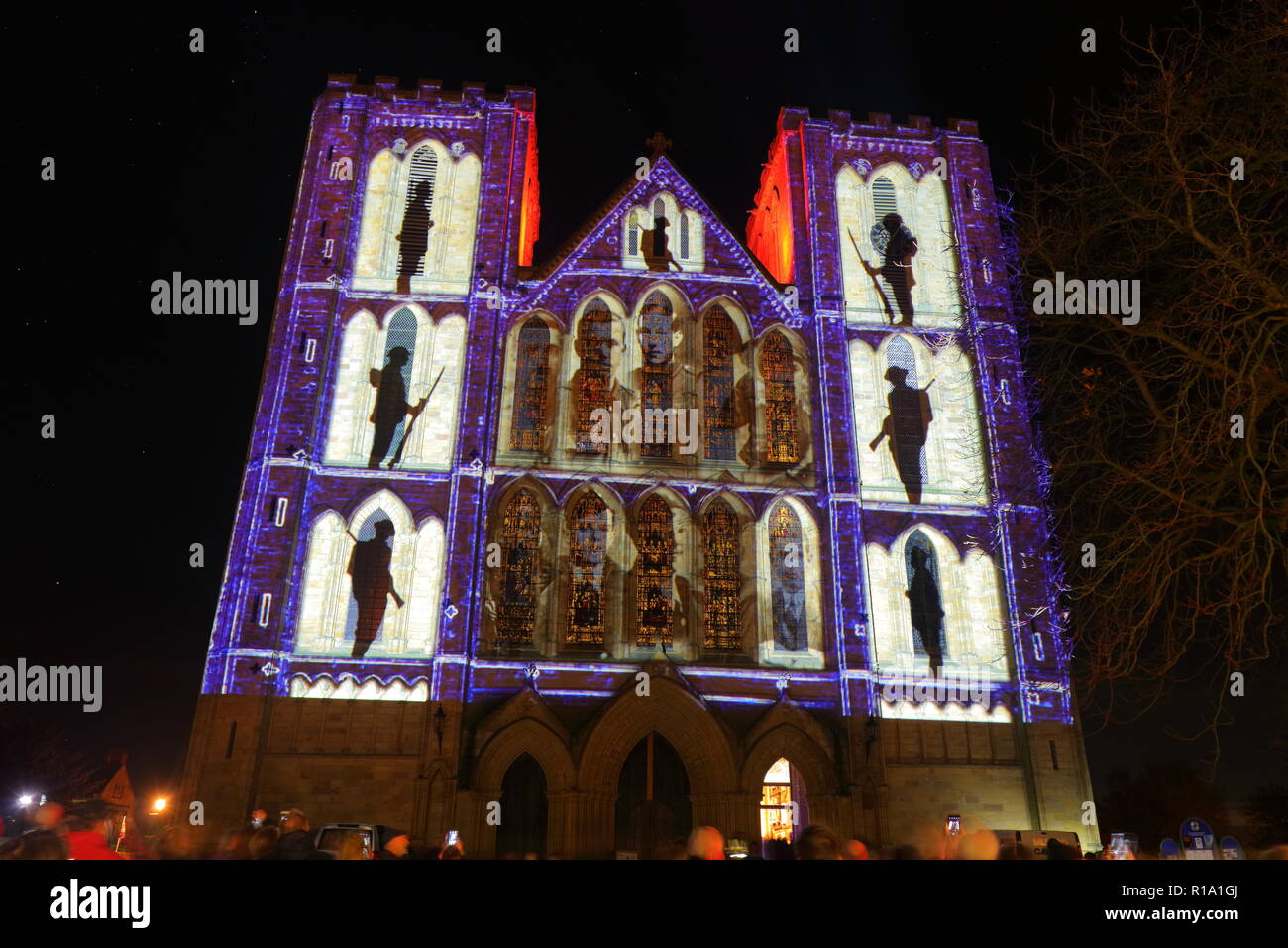 Ripon, North Yorkshire,10th November 2018. Ripon Cathedral lit up by animated projection, which shows photos from WW1 and lists of men who lost their lives during the war. Credit: Yorkshire Pics/Alamy Live News Stock Photo