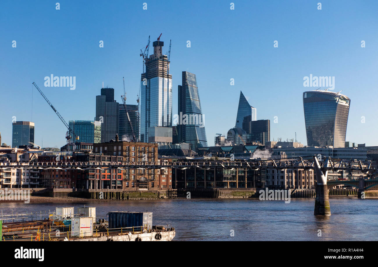 The City of London from underneath the Millennium Bridge on a sunny day in summer Stock Photo