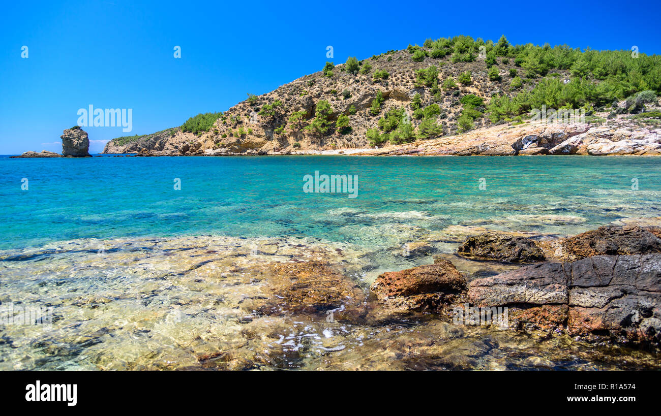 Beautiful breathtaking mountain landscape in summer - green grass, forest, rocks, sunshine, amazing light - perfect spot to hike and appreciate nature Stock Photo