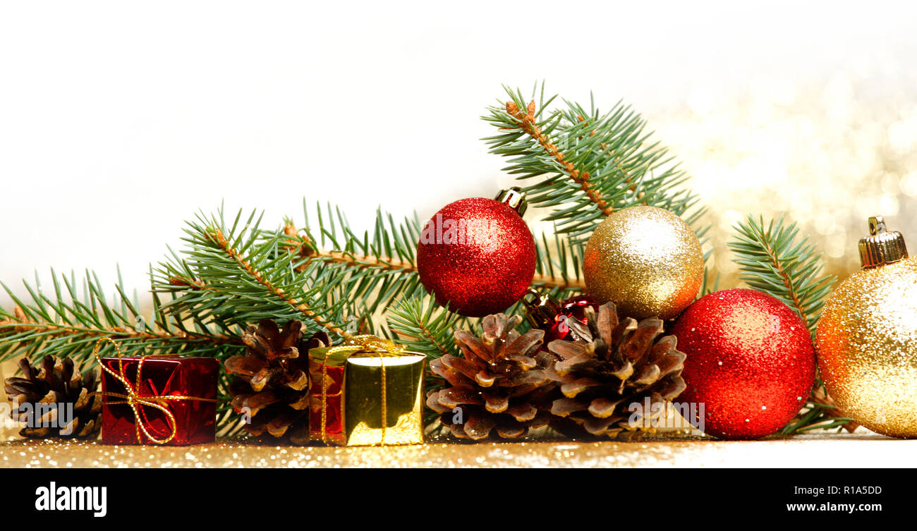 Christmas card with fir, balls and presents on glitter background Stock ...