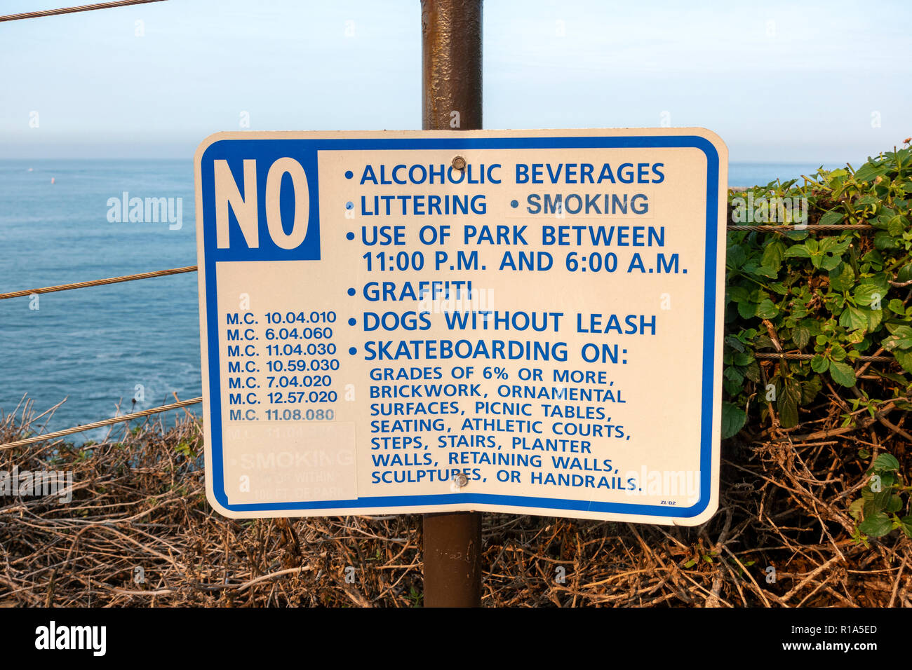 Local sign banning various activities (alcohol, graffiti, skatebioarding, smoking etc Inspiration Point, Corona del Mar State Beach, California, USA. Stock Photo