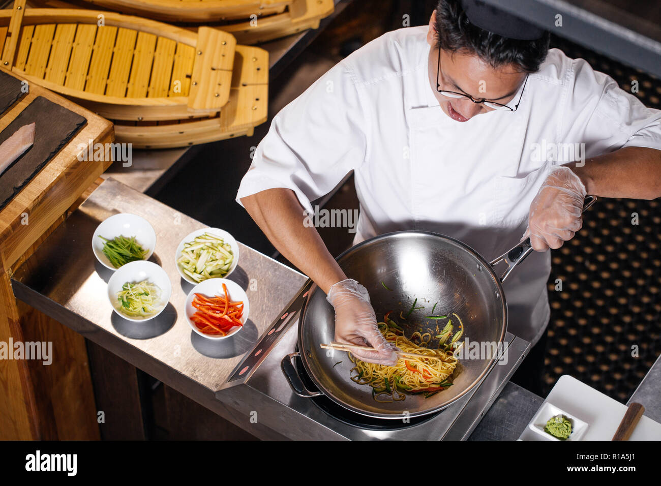 close up top view shot. chef trying to take noodle with chopsticks Stock  Photo - Alamy