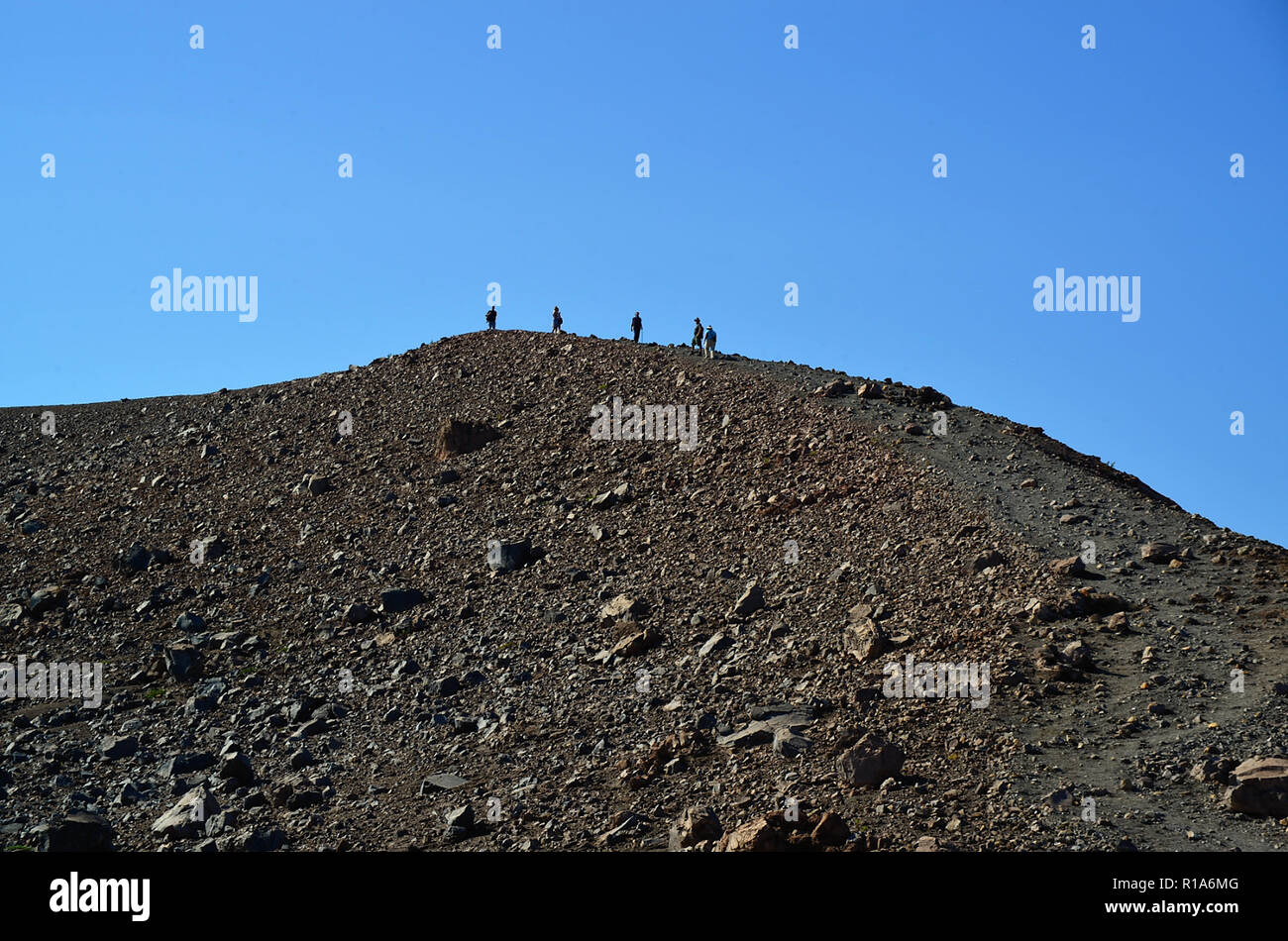 Aeolian islands, Sicily, Italy. Island of Vulcano, hikers visit the Gran Cratere on the top of the volcano. Stock Photo