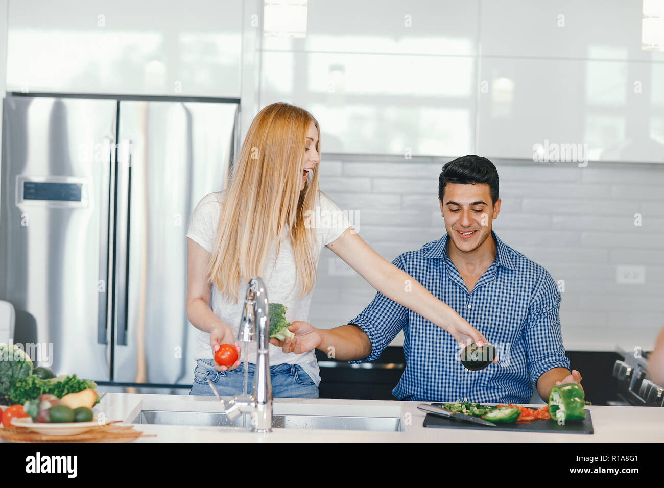 couple at home in a kitchen Stock Photo