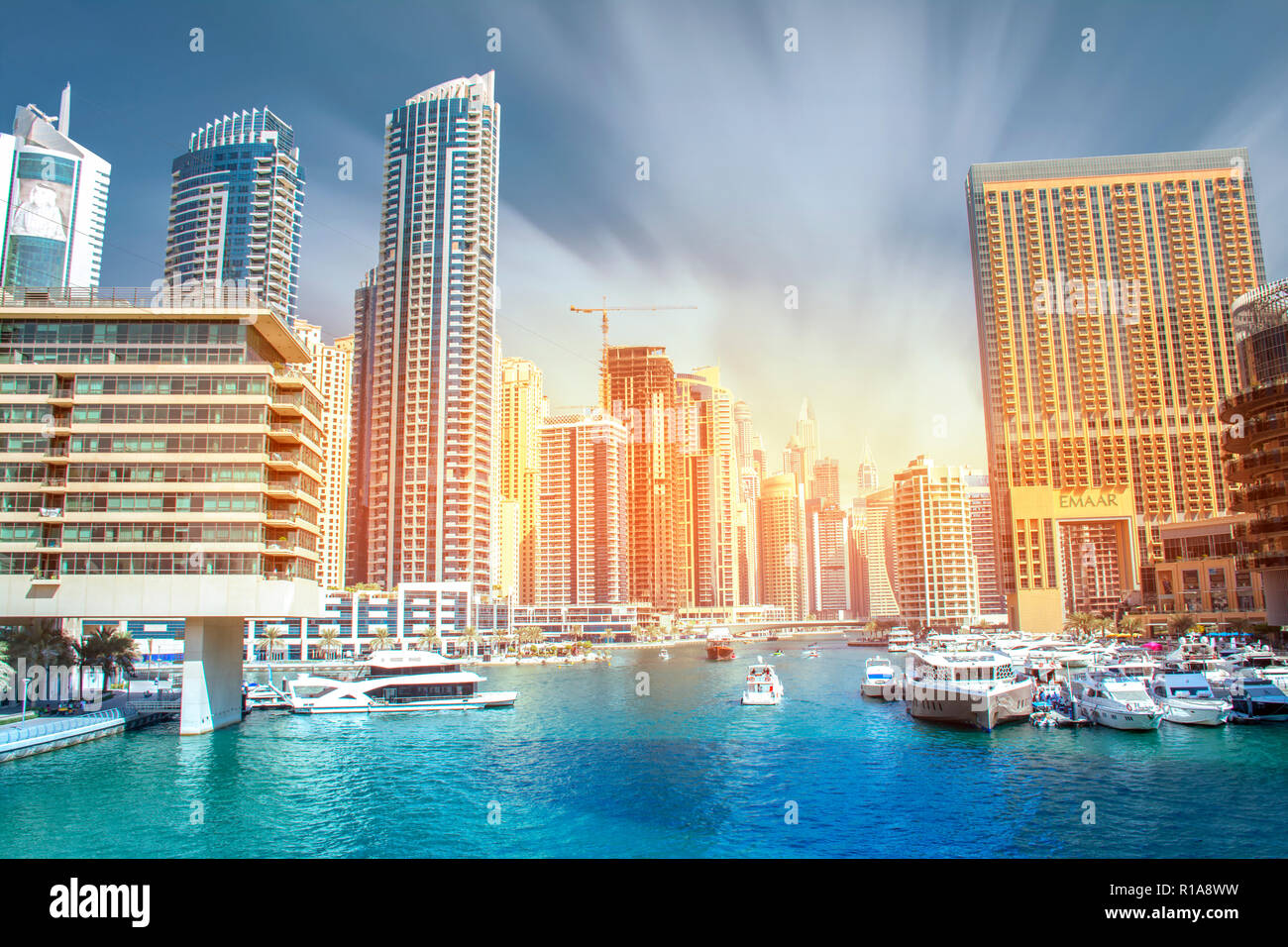 Beautiful View of Dubai Marina lake with luxury super .yacht and colorful buildings Stock Photo