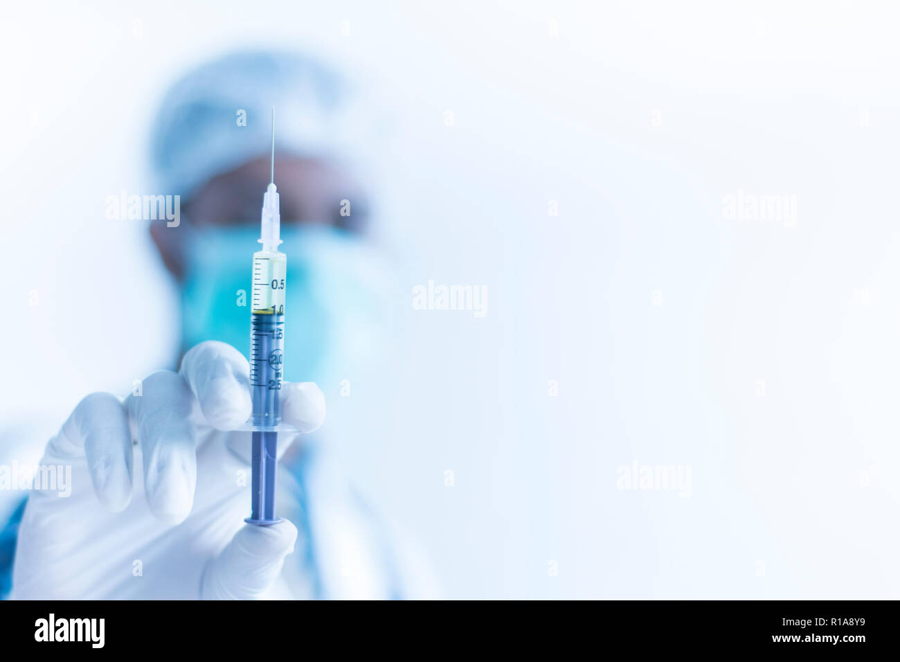 Doctor with Syringe ready to take injection, Hospital Treatment Concept Stock Photo