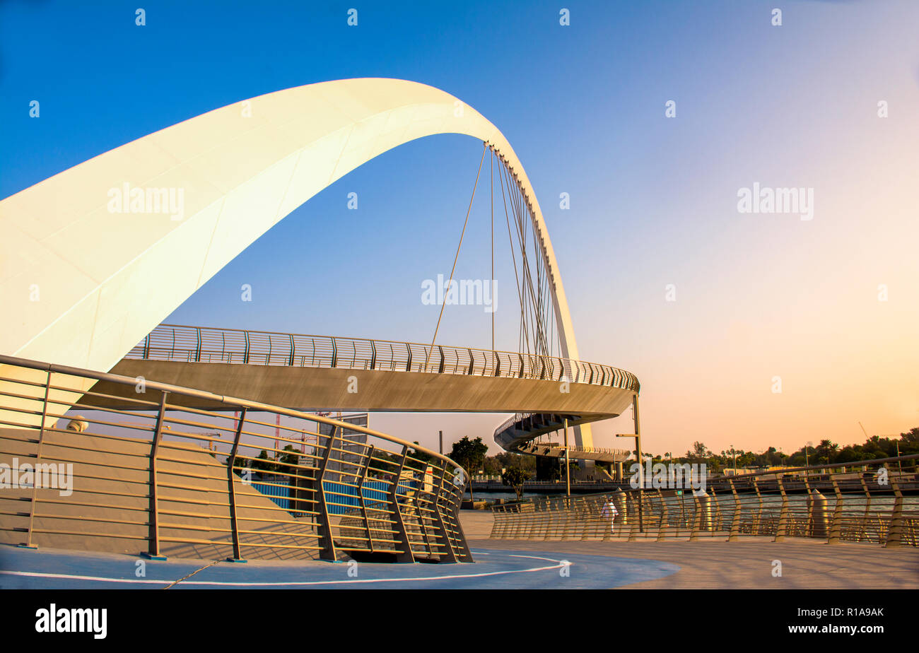 evening shot of Dubai Water Canal Bridge New Attraction of Dubai City Stock Photo