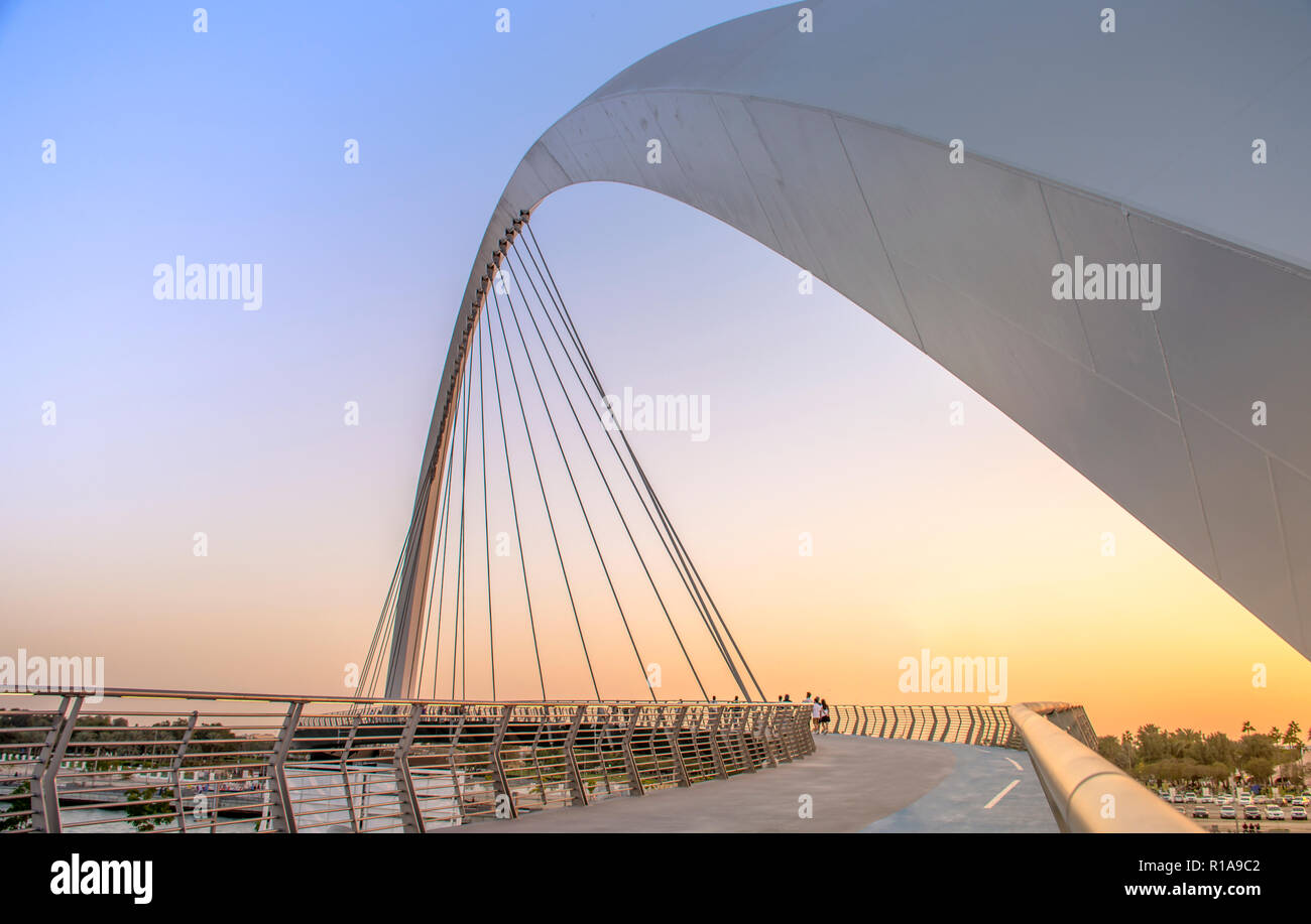 evening shot of Dubai Water Canal Bridge New Attraction of Dubai City Stock Photo