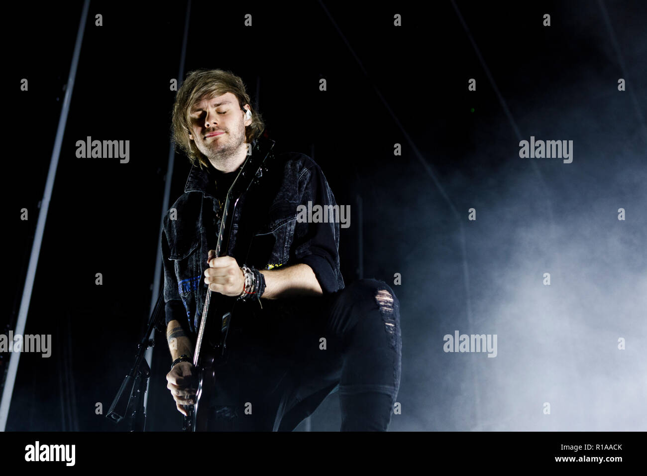 Denmark, Copenhagen - November 8, 2018. The Australian pop rock band 5  Seconds of Summer performs a live concert at Forum Black Box in Copenhagen.  Here singer and guitarist Michael Clifford is