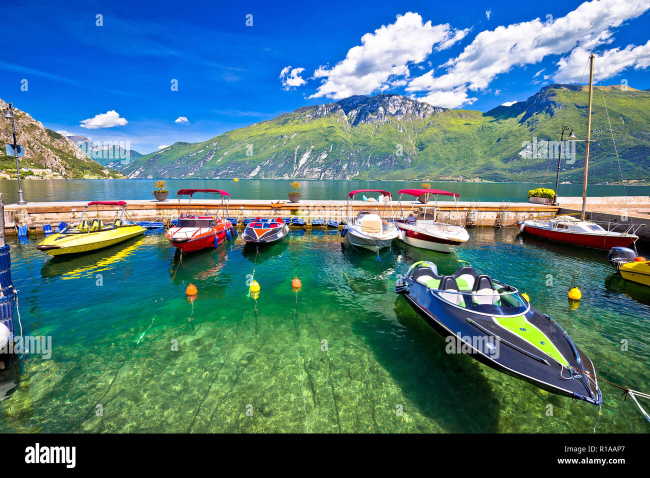 Speed boats on colorful Lago di Garda lake view, Limone sul Garda, Lombardy, Italy Stock Photo