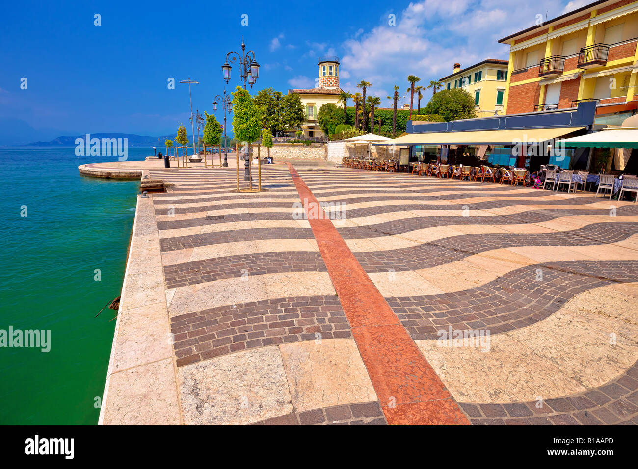 Garda lake turquoise waterfront in town of of Lasize view, Veneto region of Italy Stock Photo