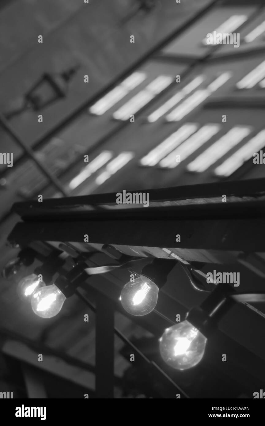 Glowing incandescent lamp black and white Stock Photo Alamy