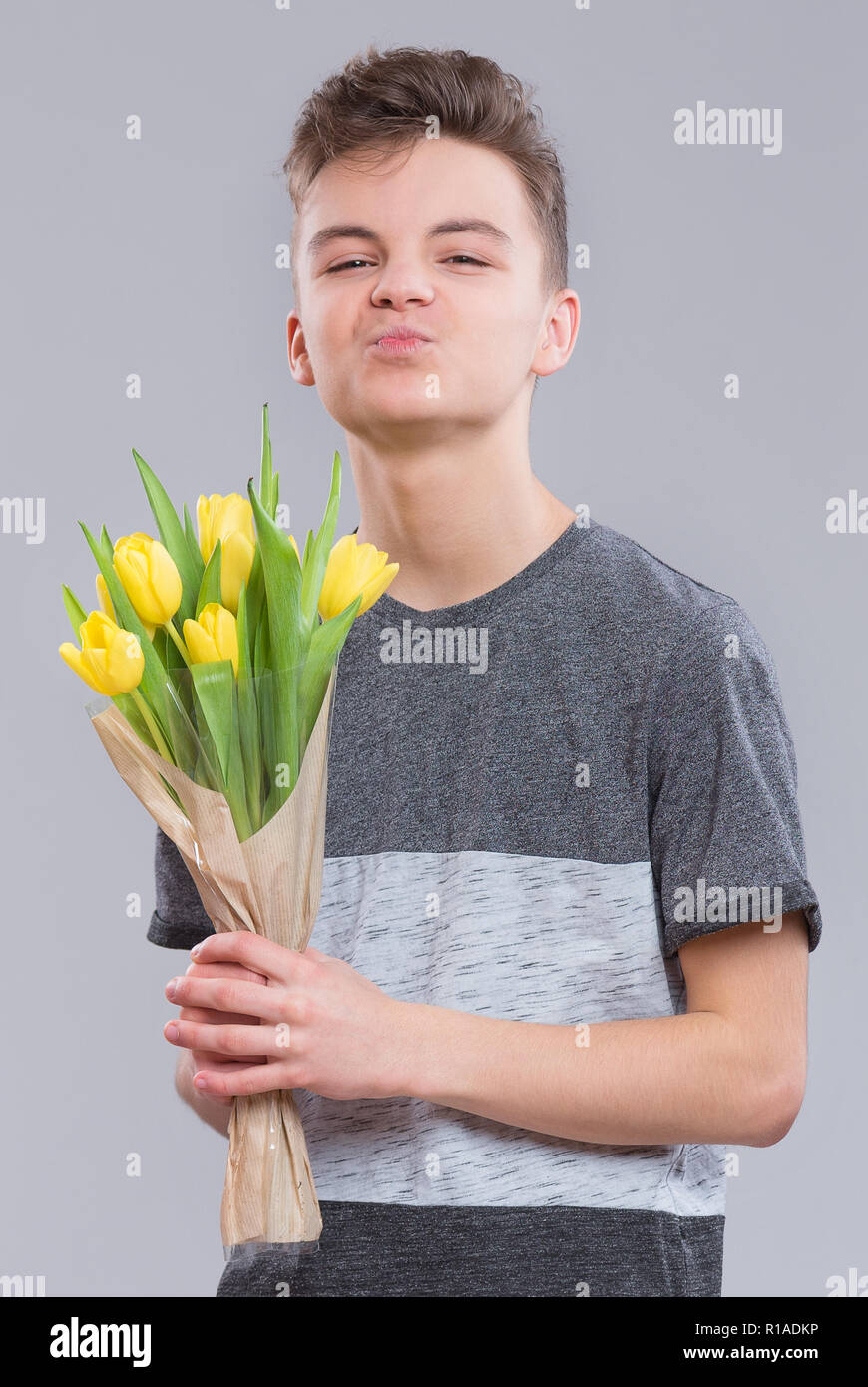 Teen boy with flowers Stock Photo
