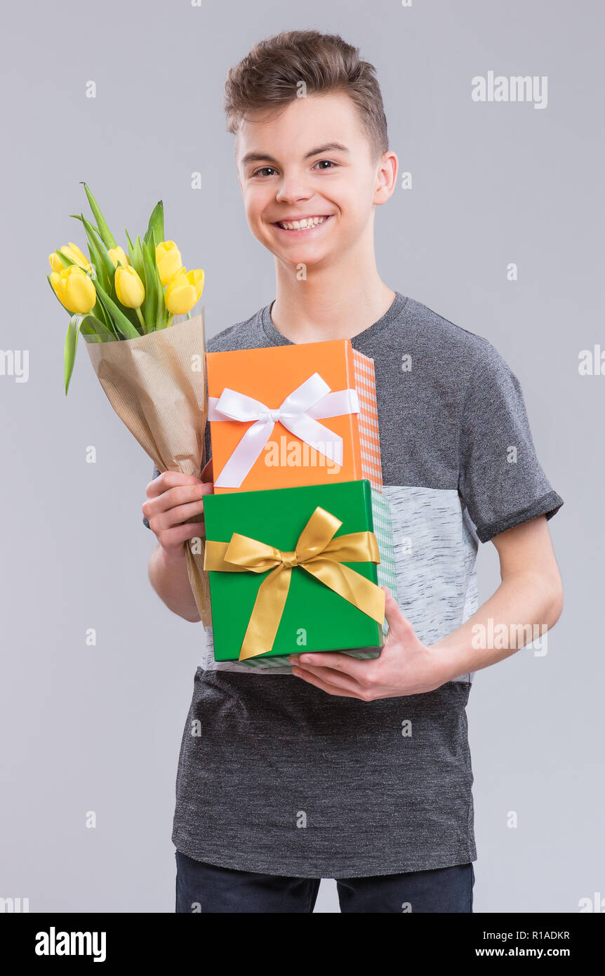 Teen boy with flowers Stock Photo