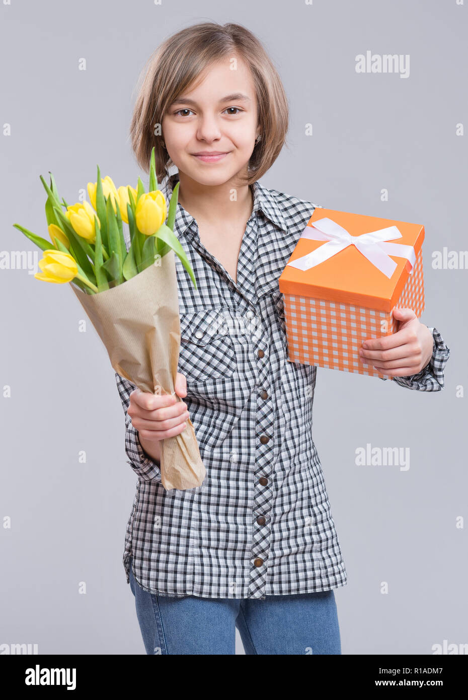 Teen girl with flowers Stock Photo