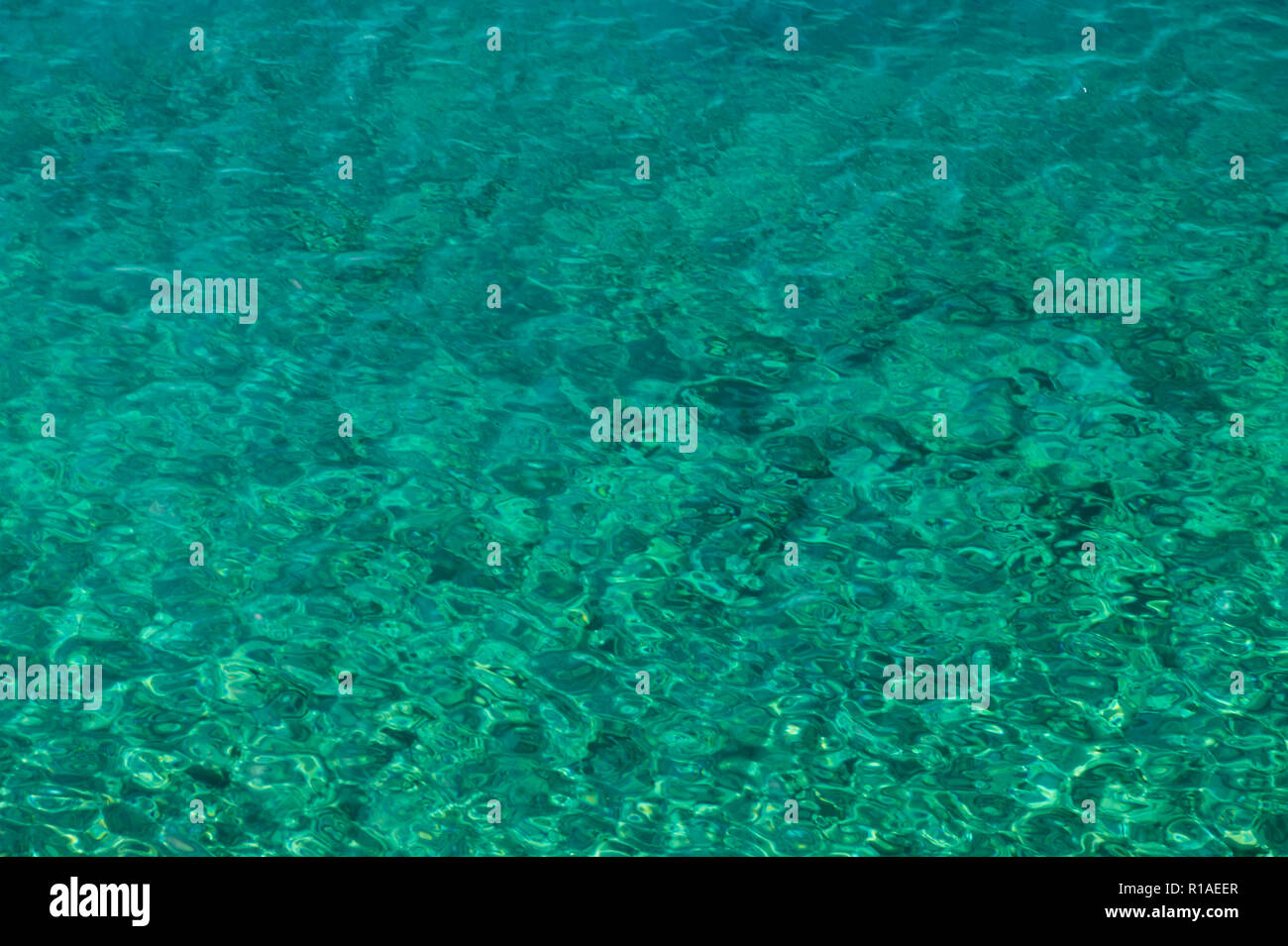 Crystal clear turquoise water surface hi res stock photography and