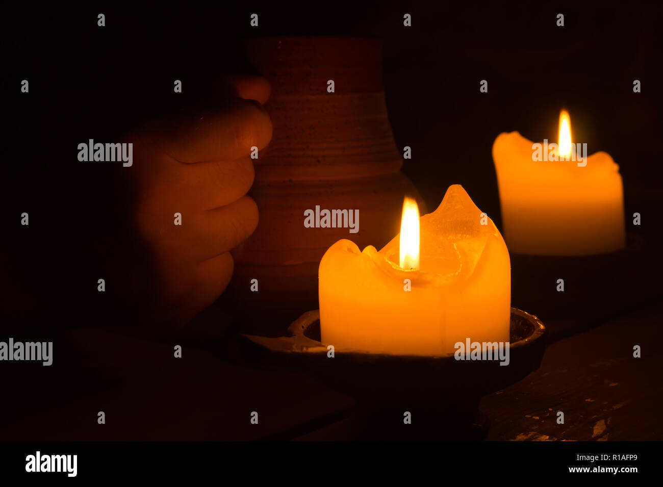 Burning candle in the dark Stock Photo Alamy