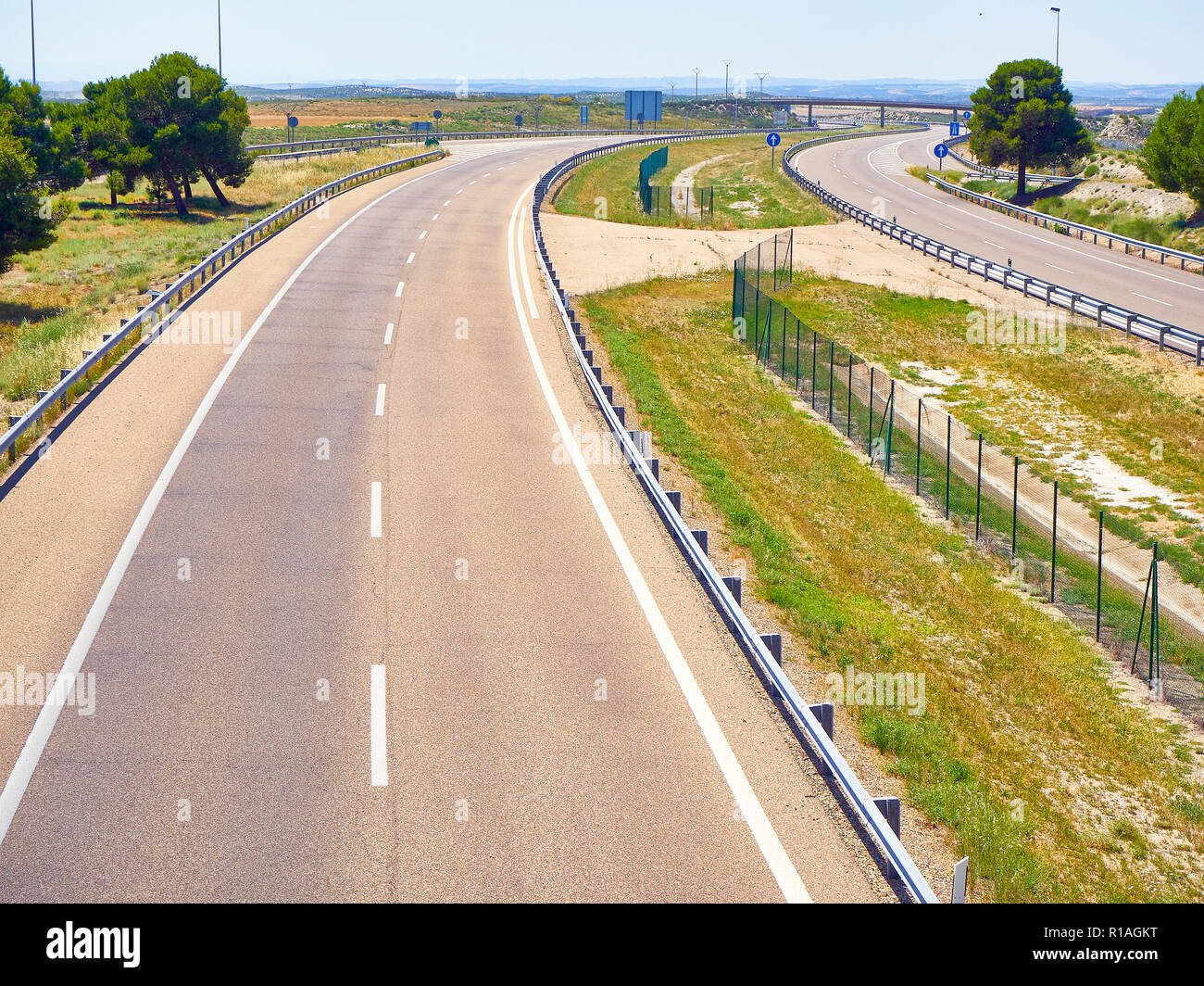 A european highway without traffic at a sunny day. Stock Photo