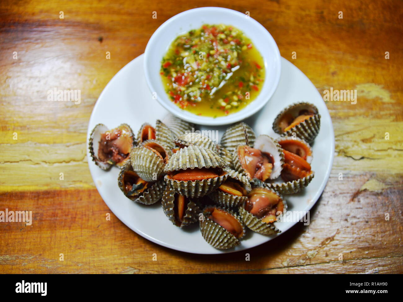 steamed blanched clam with spicy dipping sauce Stock Photo Alamy