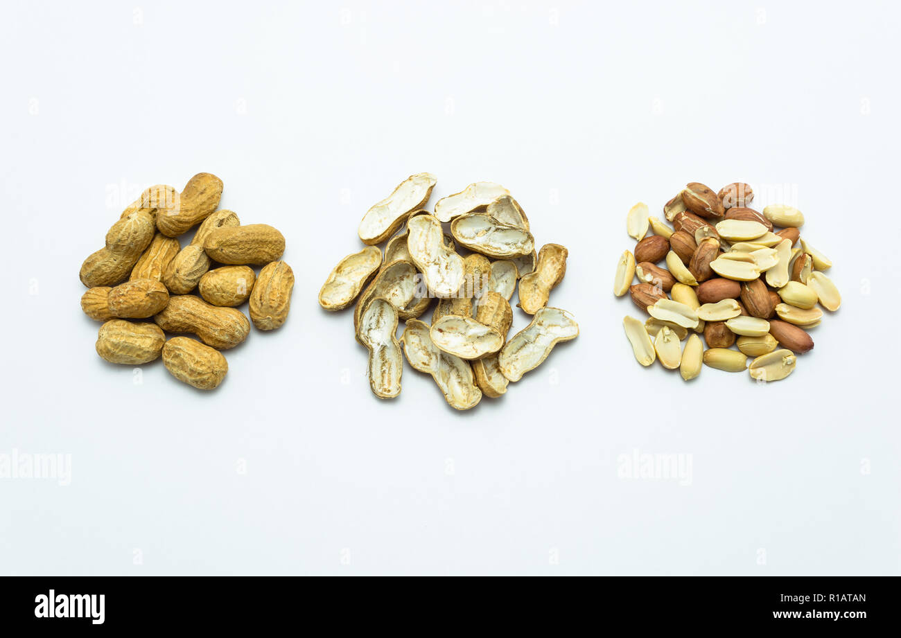Peanuts in shell and without shells isolated on white background with clipping path. Stock Photo