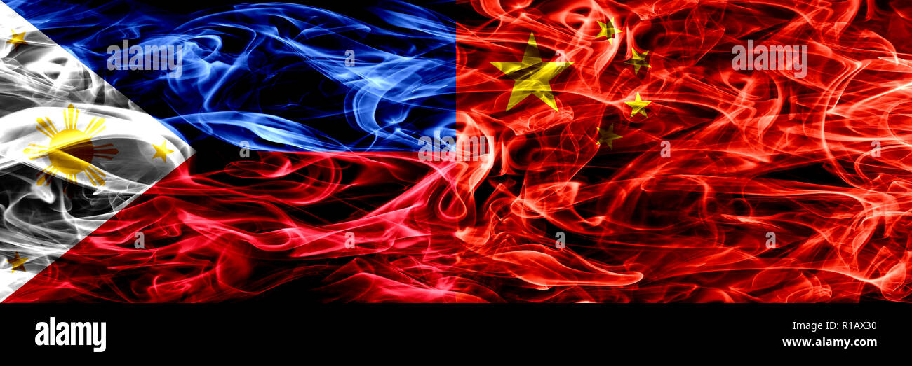 Philippines vs China, Chinese smoke flags placed side by side. Thick abstract colored silky smoke flags Stock Photo