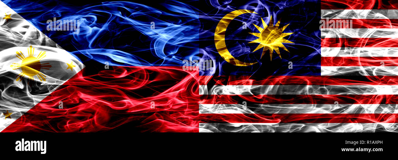 Philippines Vs Malaysia Malaysian Smoke Flags Placed Side By Side Thick Abstract Colored Silky Smoke Flags Stock Photo Alamy